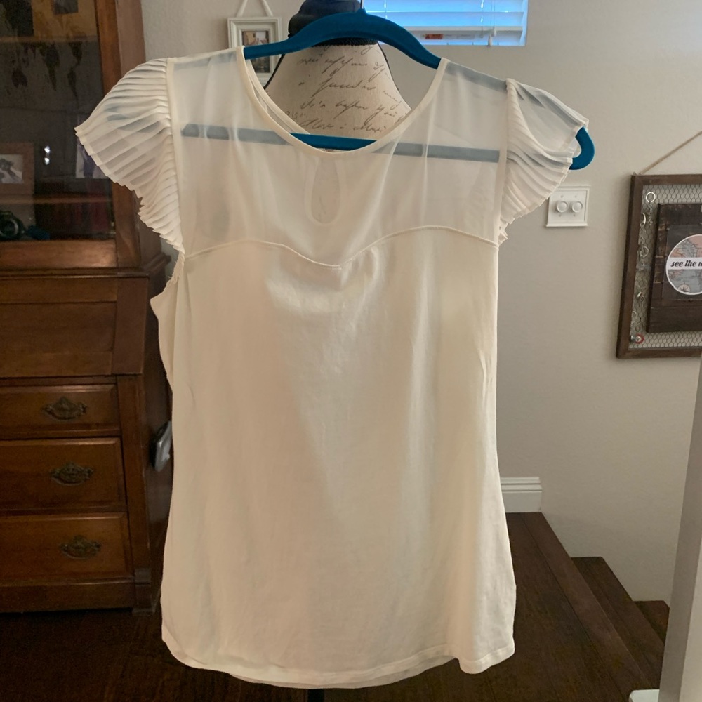 Cream express medium top faux sweetheart neckline.